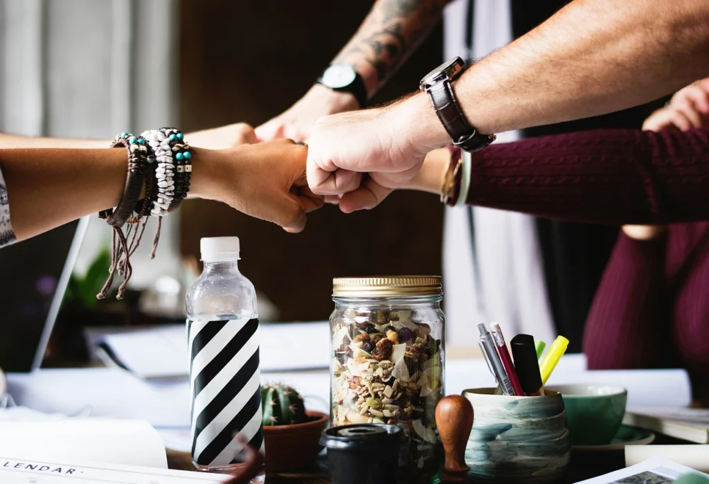 A team of people collaborating around a whiteboard with SEO strategy notes