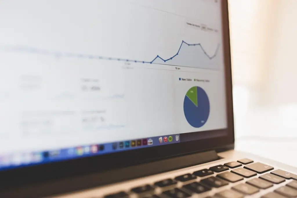 SEO dashboard with keyword rankings and backlink data on a monitor